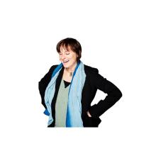 Rebecca Todd stands with her hands on her hips. laughing